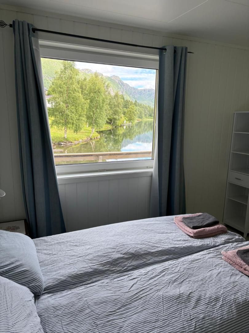 Bedroom with a view of the lake and mountains