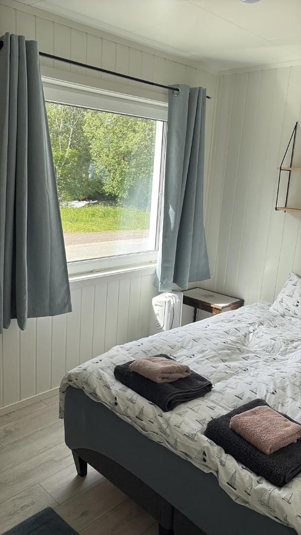 Bedroom with a double bed by the window