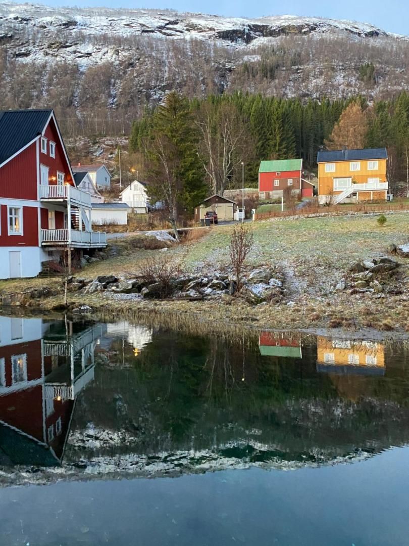 Red houses on the shore, seen from the apartment